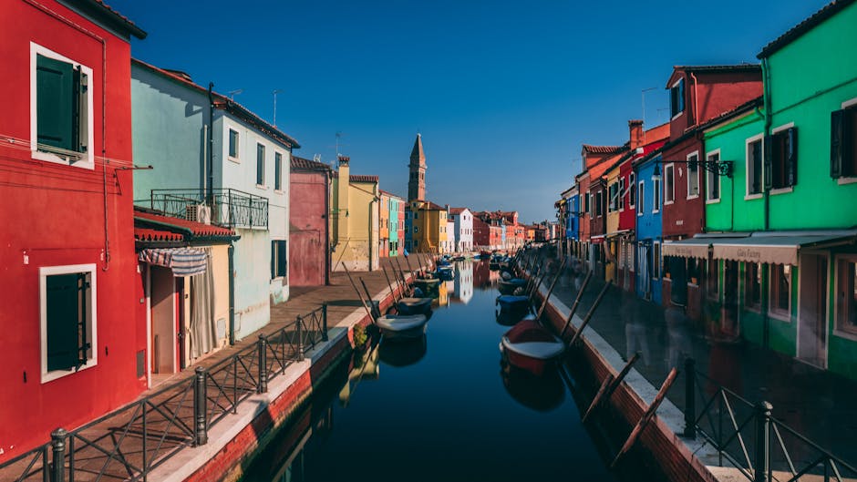 Burano colorful houses canal reflection morning