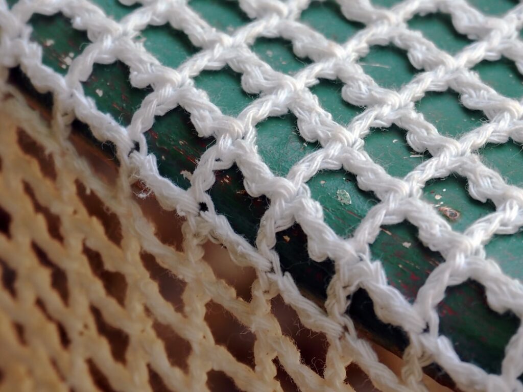 Burano lace maker bobbin lace hands close-up