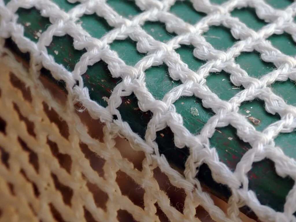 Burano lace maker bobbin lace hands close-up