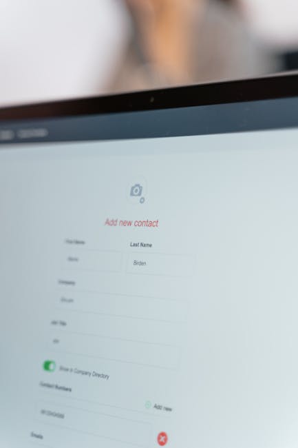 Close-up computer screen showing 'Add new contact' form fields.