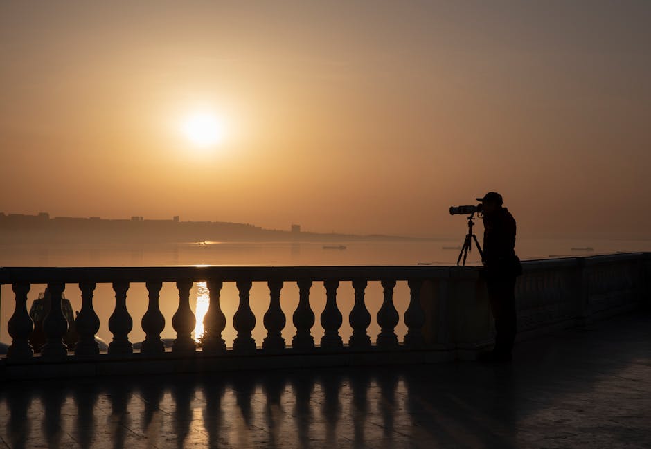 Fotografo che cattura il tramonto all'Organo Marino con treppiede