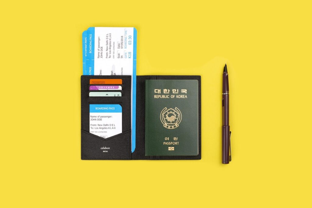 Traveler holding passport and tax-free forms closeup