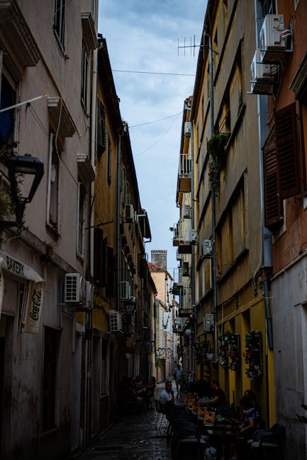 Sunlit narrow alley in Zadar old town at midday