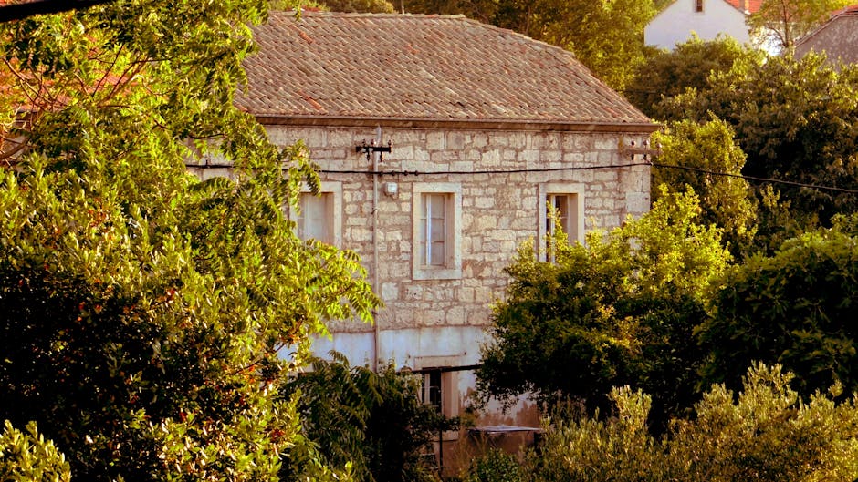 Small Croatian village with stone houses at evening glow