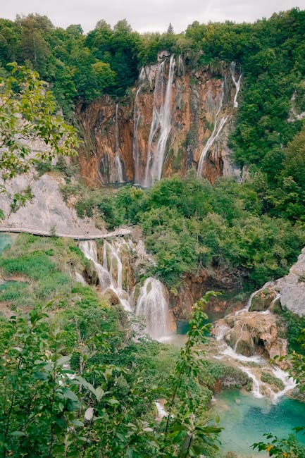 Cascading waterfalls and mirrored water at Plitvice upper lakes