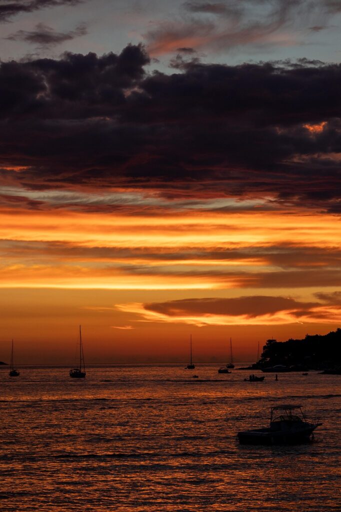 Old wooden boats moored along Hvar's coastal promenade