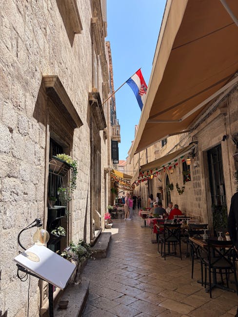 Outdoor cafe serving a Croatian breakfast on a stone street