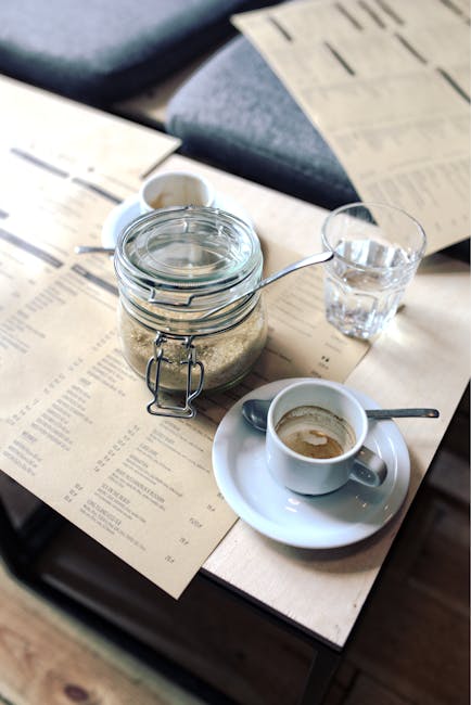 Outdoor restaurant table on St. Stephen's Square with menu and espresso