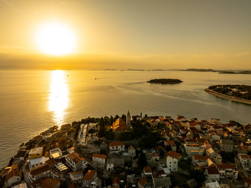 Sunset over Hvar old town rooftops in golden light