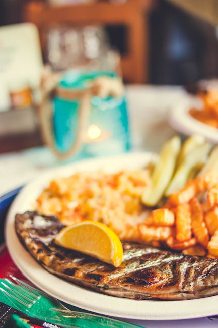 Traditional Dalmatian dinner of grilled fish at a seaside restaurant in Hvar