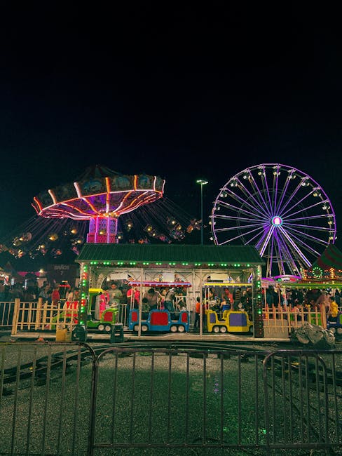 Folla e casetas illuminate durante la Feria de Abril di notte