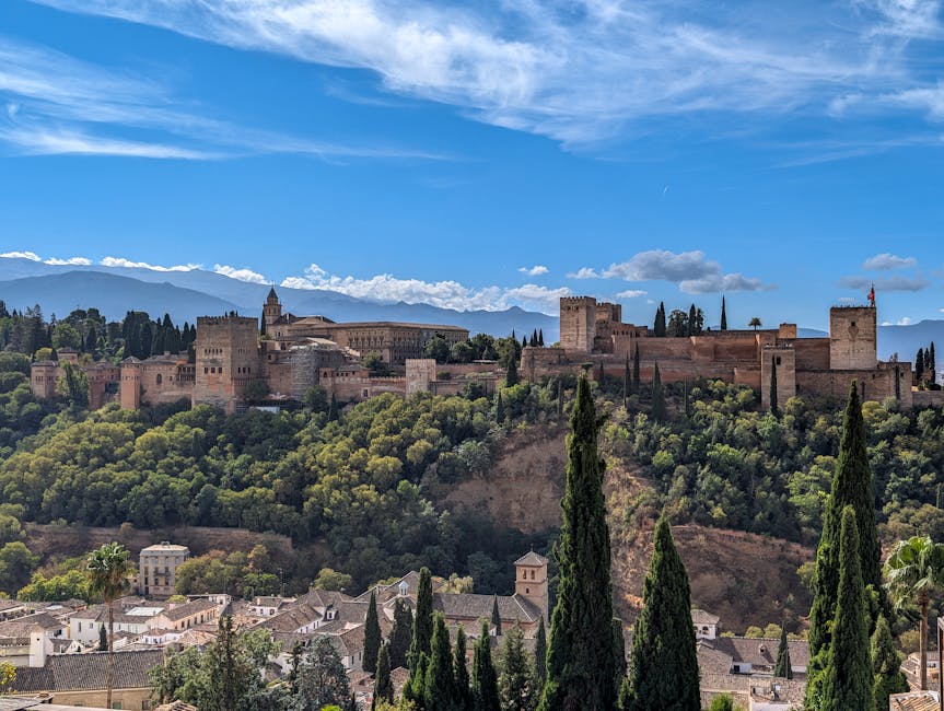 Alhambra palaces at sunset viewed from the valley