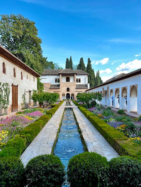 Generalife water channel reflecting palm trees