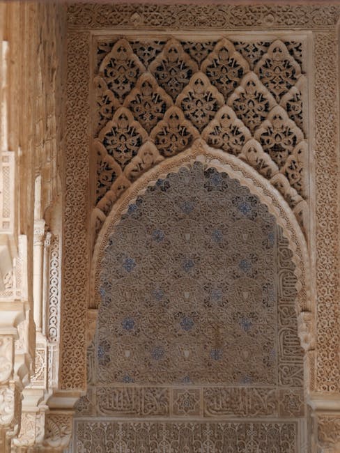 Intricate stucco with Arabic inscriptions in a Nasrid palace