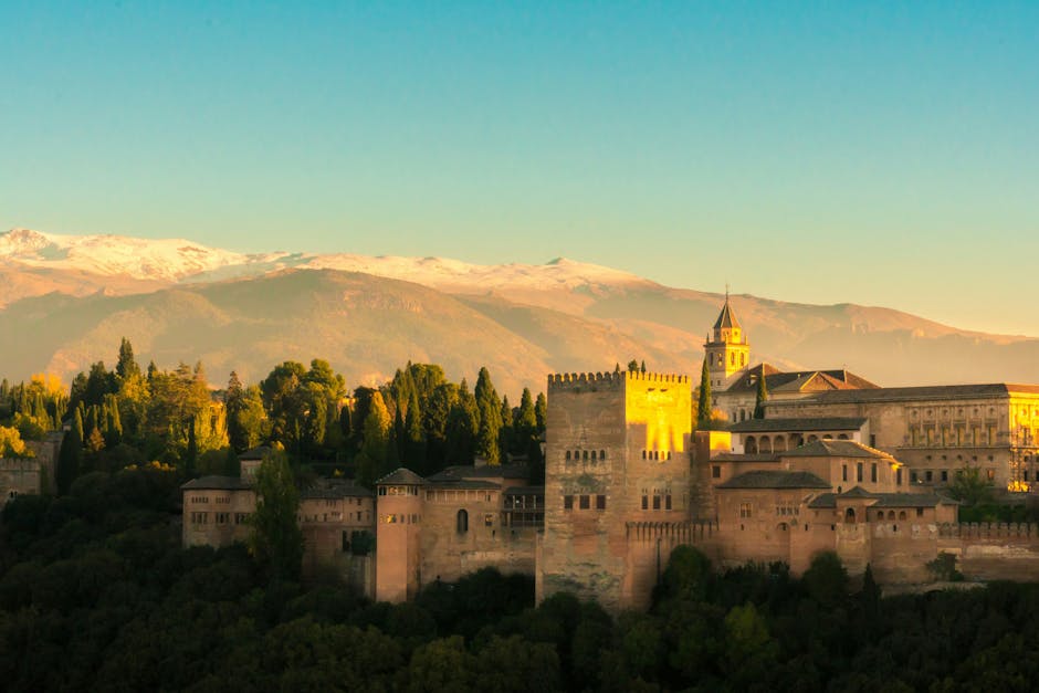 Granada cityscape at sunset with the Alhambra and Sierra Nevada