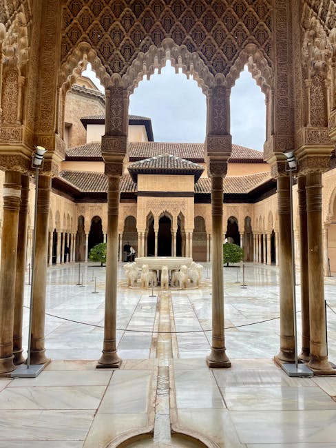 Alhambra courtyard fountain and columns in morning light