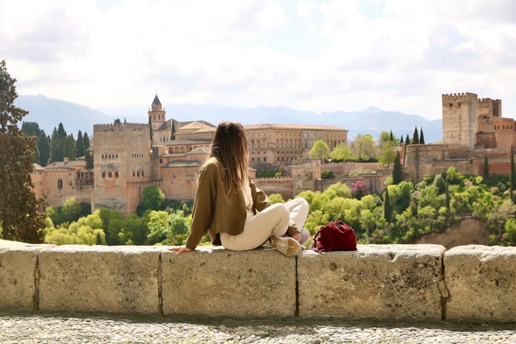 Paseo de los Tristes riverside walkway in the evening with Alhambra view