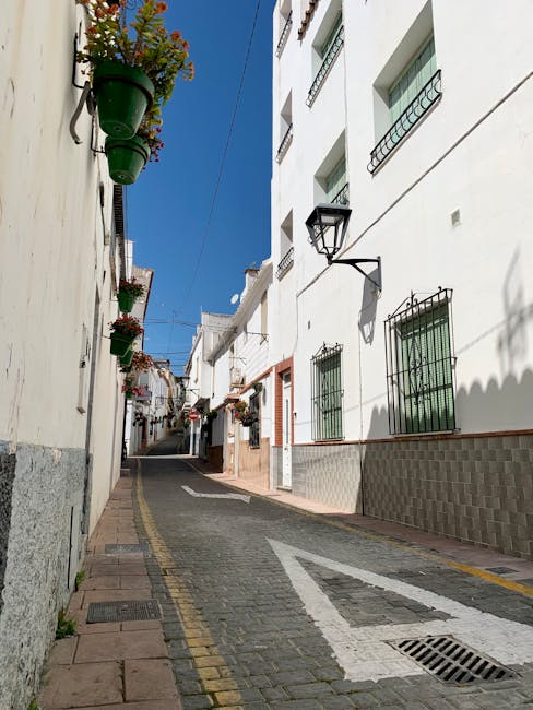 Quiet stone street San Pedro with balconies
