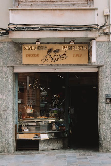 Small bakery storefront on a stone street