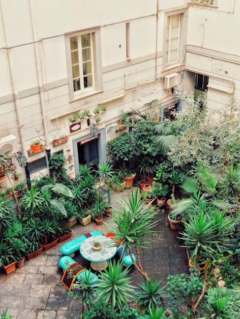 urban garden café courtyard with plants and outdoor tables