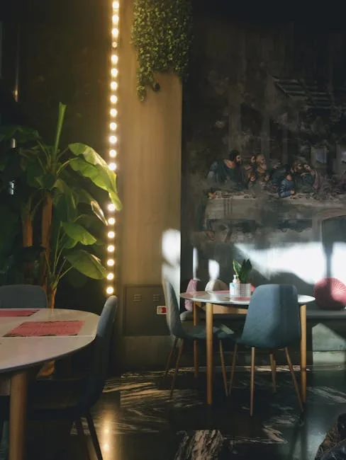 Cozy modern café interior in Porto with round tables, plants, and mural
