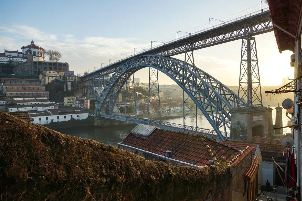 Iron arch Dom Luís I bridge spanning the Douro River in Porto at sunrise