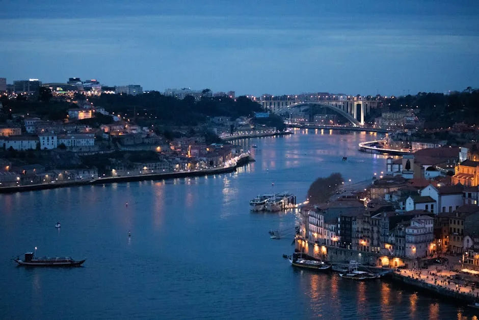 Evening Ribeira with riverboats and lit buildings