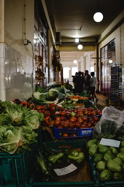 Indoor Porto market stall piled with lettuce, tomatoes, and fresh vegetables
