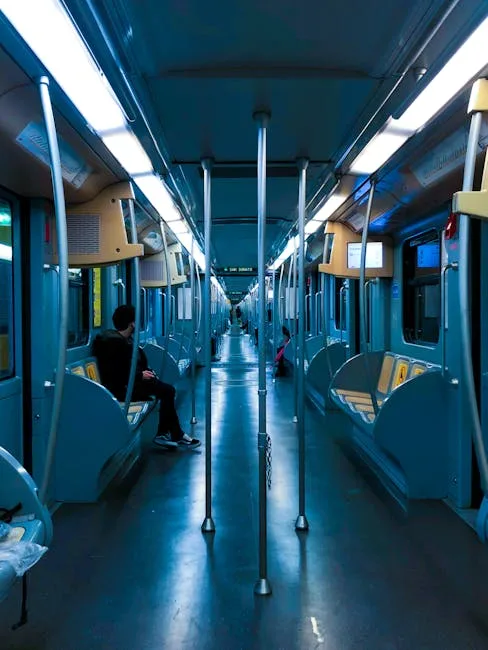Interior of Porto metro train with blue seats and passengers