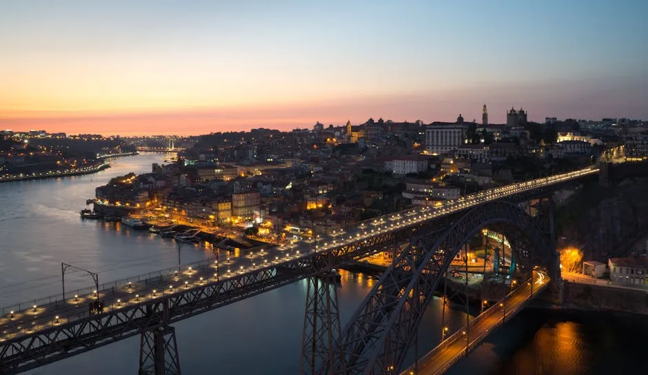 Porto skyline at sunset with Dom Luís I Bridge illuminated