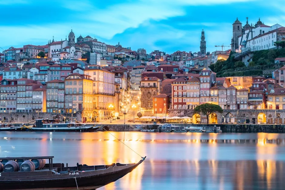 Porto Ribeira riverside at dusk with Rabelo boat and lights