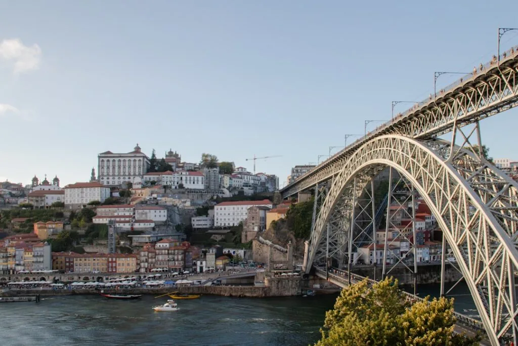 Dom Luís I Bridge arch spanning the Douro River with Porto hillside buildings
