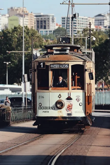 Historic Porto tram labeled 'Passeio Alegre' approaching along tracks