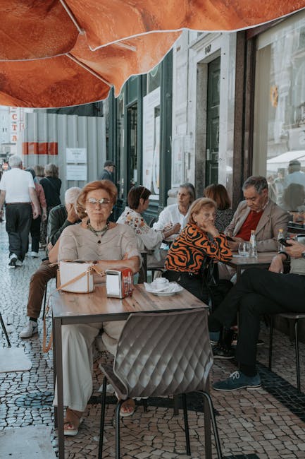 Local Porto street with cafe terrace and people smiling