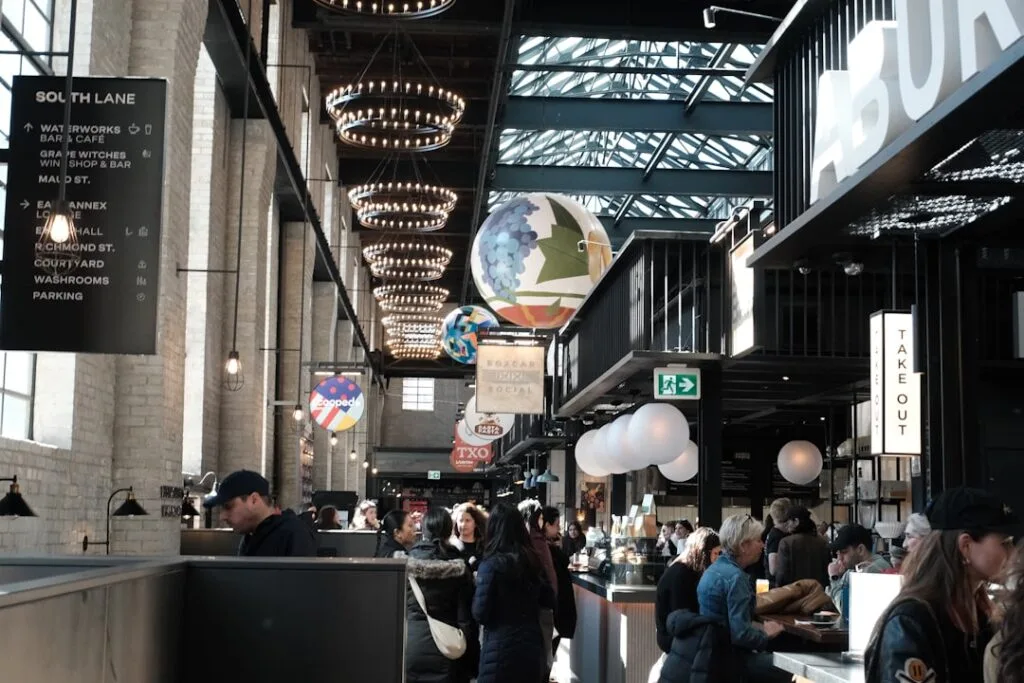 Modern indoor food hall in Porto filled with diners and stalls