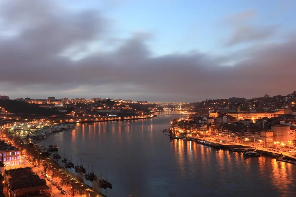 Nighttime panorama of Porto and the Douro River illuminated by city lights