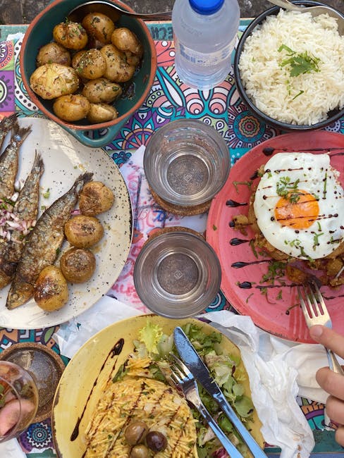 Table set with a gluten-free Portuguese meal: grilled fish and salad