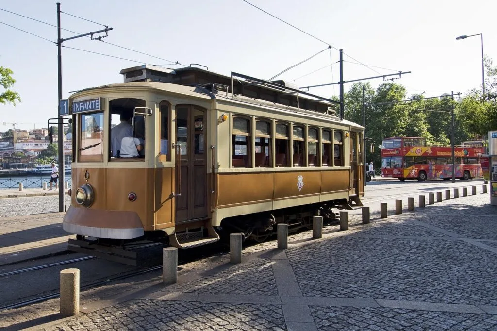 Brown historic tram parked along Porto riverside near Douro