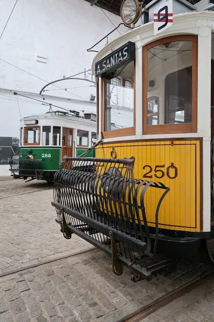 Yellow vintage tram car 250 displayed inside Porto tram museum