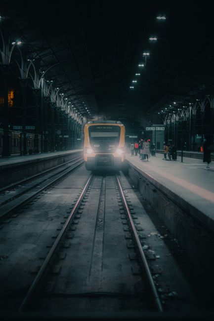 Train at a dimly lit station platform in Porto