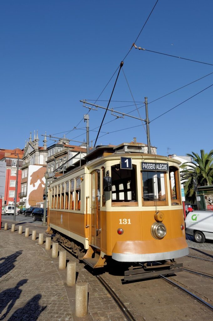 Vintage yellow tram 131 with Passeio Alegre sign on Porto street