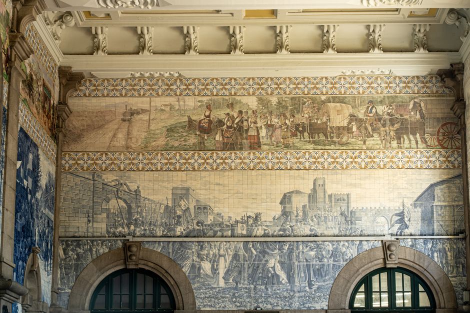 Historic blue and painted tile panels inside São Bento Station, Porto
