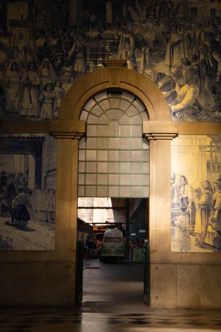 Doorway framed by blue azulejo tiles inside Porto's train station