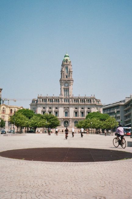 Porto city hall building with clock tower in open plaza