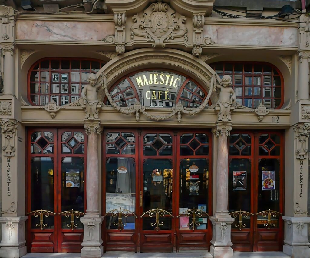 Ornate Majestic Café entrance with carved stone details in Porto