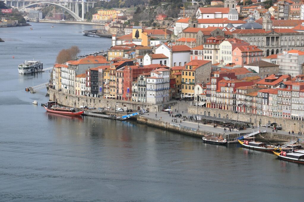 Riverside Ribeira district in Porto with colorful houses and boats