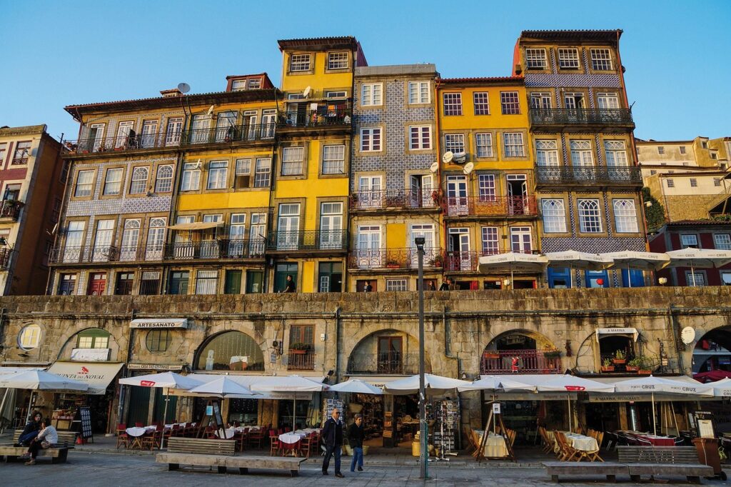 Colorful Ribeira riverside buildings and waterfront cafés in Porto
