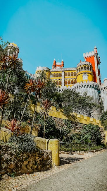 Narrow access road to Pena Palace with parked cars