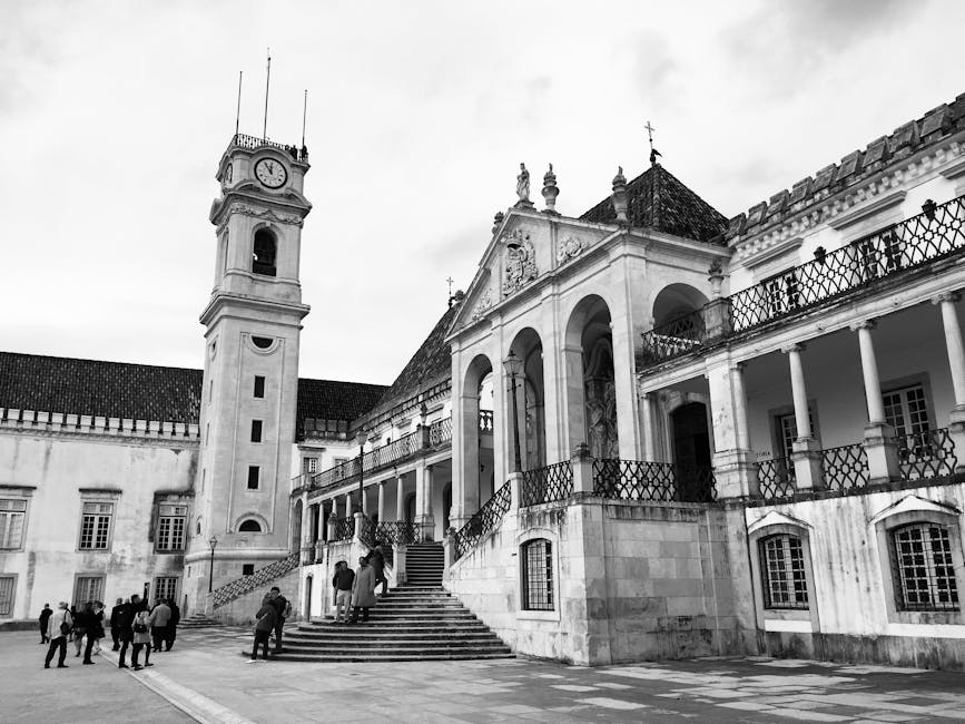 Grand staircase at the University of Coimbra with students