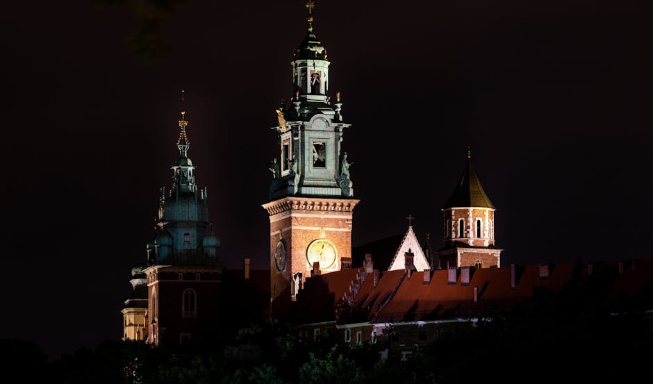 Wawel Castle illuminated at night seen from the riverbank